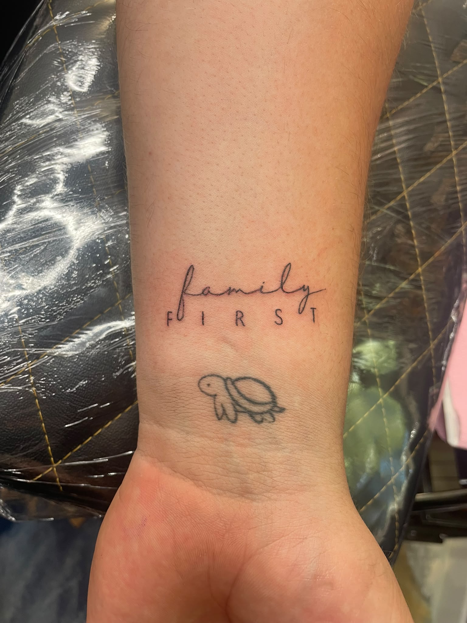 Healing fine line wrist tattoo after professional tattoo session